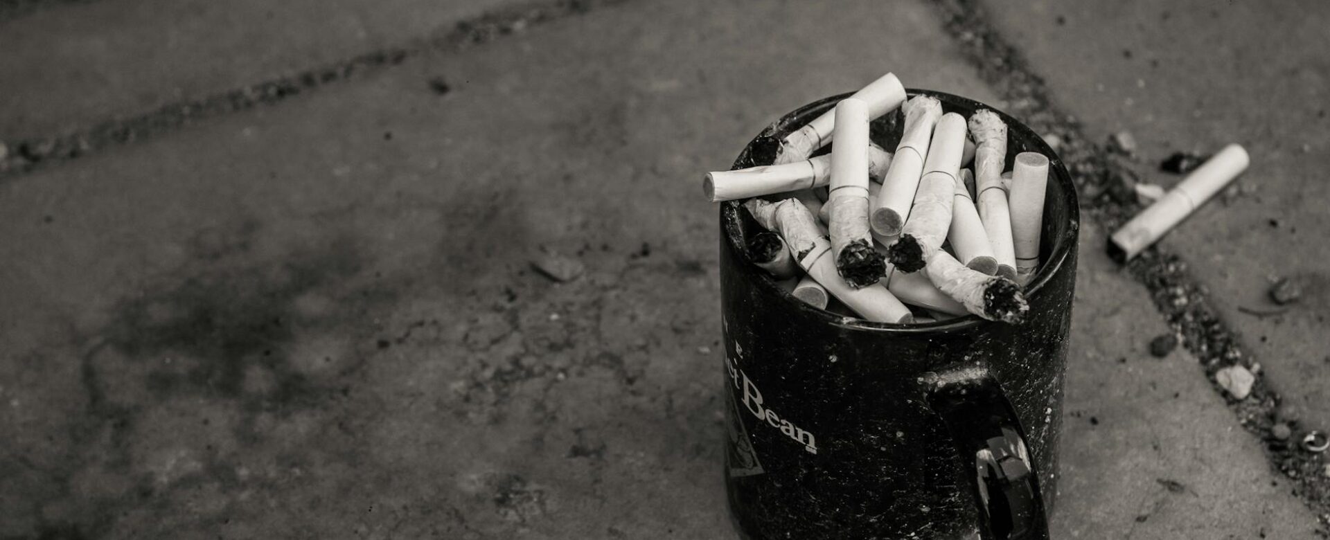 cup full of burnt cigarettes