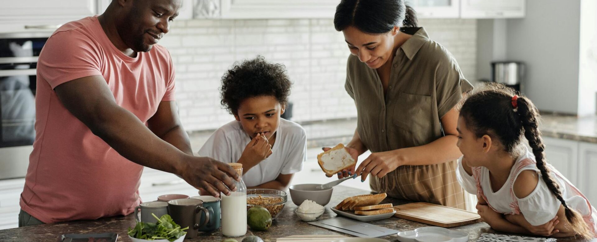 family making breakfast in the kitchen