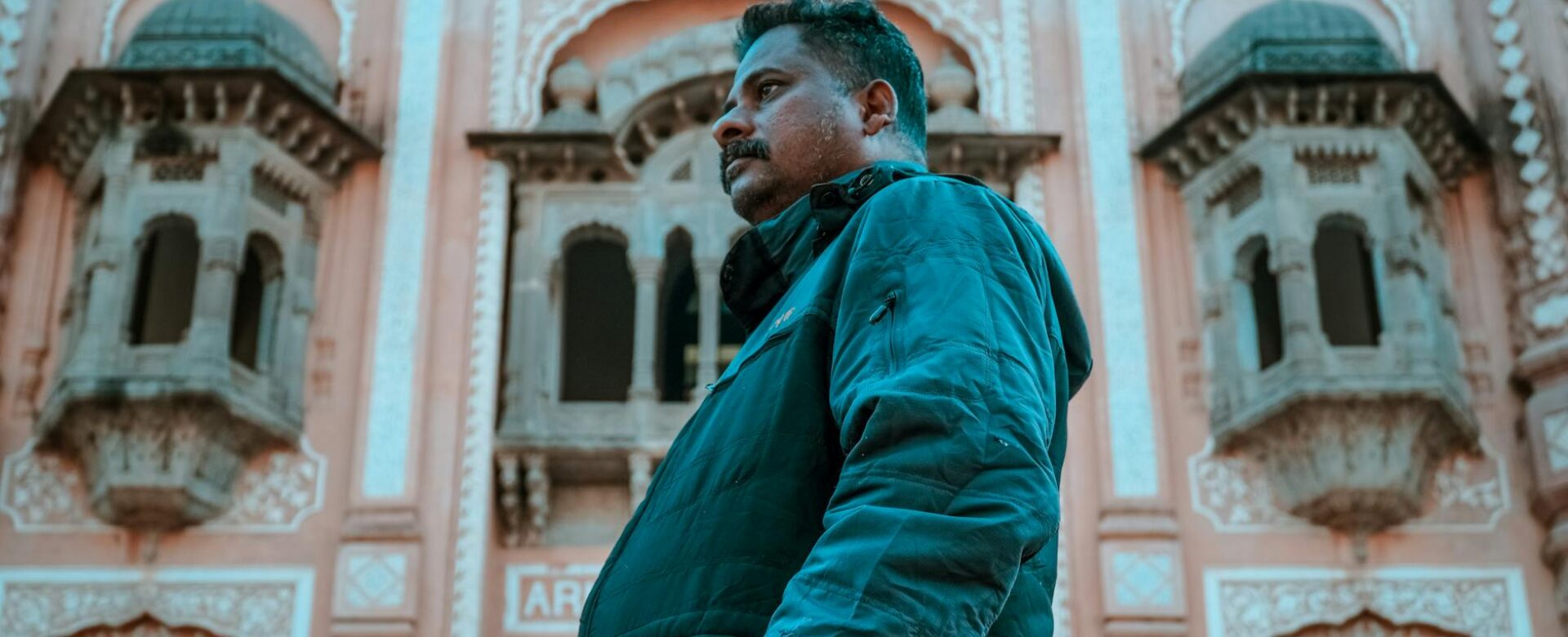 man with mustache in jacket