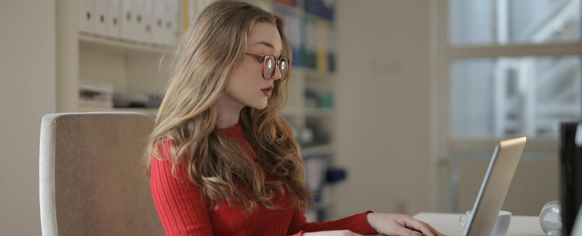 focused woman working using laptop